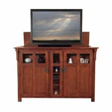 With tv risers, give your tv or computer monitor a couple inches of height for either the ideal viewing angle, or for help in keeping your desk or entertainment center organized. Tv Lift Cabinets Touchstone Home Products Inc