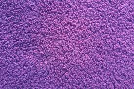 close up view of purple carpet texture