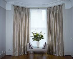 bay windows with curtains and blinds