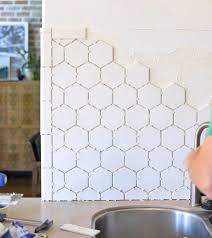 How to install glass mosaic tile backsplash part 2 installing the tile. How To Install A Backsplash The Budget Decorator