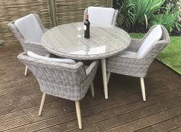 Seat the whole party in style with a chic outdoor dining set. Signature Weave Danielle 4 Chair Round Table Garden Dining Set
