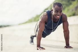 young athletic man doing push ups