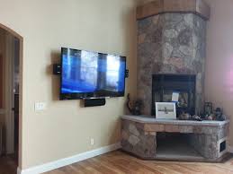 Curved Television Mount Above Fireplace