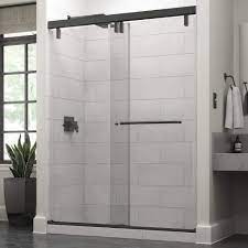frameless sliding shower door in bronze
