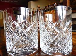 heavy cut pair of crystal whiskey glasses