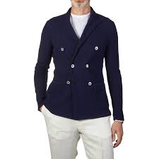 Designed with classic peak lapels and a double breasted front, this soft twill blazer promises the crisp look and comfortable fit you want. Lardini Blue Double Breasted Knitted Cotton Blazer Baltzar