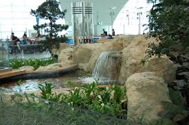 Beautiful waterfall inside dubai mall, april 17, 2010 in dubai, uae. Dubai Airport Waterfall