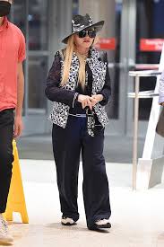 She looked 10 years younger than her 62 years. Madonna Rocks Louis Vuitton Vest Fedora At Jfk Airport Hollywood Life