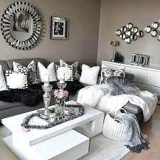 The modern living room features grey walls, deep charcoal cabinets and a french door that opens out to the yard. Black White Grey Living Room Design