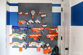He got this for christmas. Nerf Wall Pegboard Storage Sugar Bee Crafts