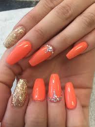 Want to try nail art on your finger nails? Hot Orange Colors And Rhinestone Designs Orange Acrylic Nails Rhinestone Nails Orange Nails