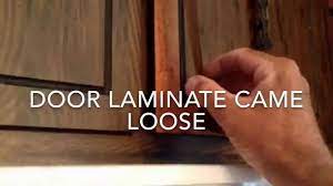 how to reglue laminate on cabinet door