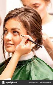 makeup artist hairdresser prepare bride