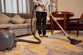hotel service staff use vacuum cleaner