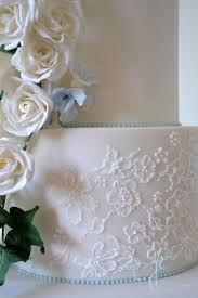 White Cascading Rose Wedding Cake With Blue Hydrangea