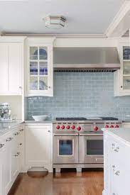 white kitchen cabinets with blue glazed