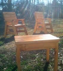 Outdoor Arm Chairs And A Side Table