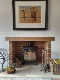 A Tv Above A Wood Burning Stove