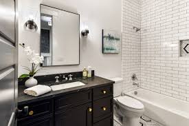 75 white tile bathroom with black
