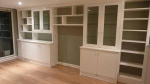 Wall To Wall Storage Including Glass