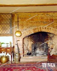 Warming Pan On Brick Fireplace In Old