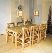 brown bamboo dining table with 6 chairs