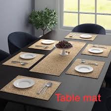brown plastic dining table mat set at