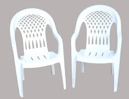 Two White Plastic Stacking Patio Chairs