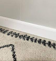 how to paint baseboards with carpet in