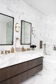 Brown Bathroom With Marble Tiled Walls