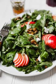Finish the salad by drizzling with dressing and topping with crumbled goat cheese. Autumn Kale Apple Salad With Goat Cheese Pistachios Zestful Kitchen