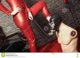 Dominatrix in Red Latex Play with Gas Mask Stock Image - Image of hold,  domme: 76518069