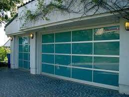 Residential garage doors are more focused on aesthetics than commercial garage doors. Glass Garage Doors Pictures And Photos Glass Garage Door Garage Doors Garage Door Styles