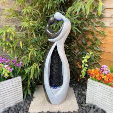 Couple Embrace Water Feature On Onbuy