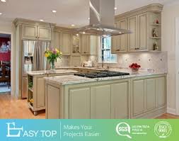 To glaze kitchen cabinets, start by letting fresh paint dry completely, then seal the paint with a coat of lacquer. China Easy Top American Faceframe Celadon Chocolate Glaze White Paint Classic Kitchen Cabinets China Ready To Assemble Kitchen Cabinets Kitchen Cabient