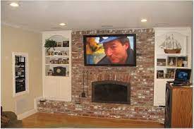 flat screen on brick fireplace