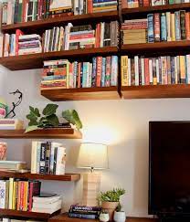 mive wall of floating bookshelves