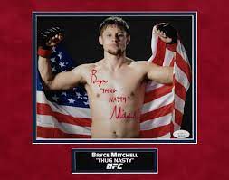 Bryce Mitchell Autograph Photo Holding Flag With Thug Nasty Inscription  11x14 - New England Picture