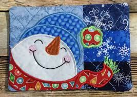 christmas patchwork mug rugs in the