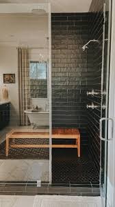 black tile shower teak bench shower