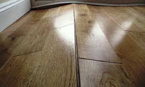 how to fix buckled wood flooring