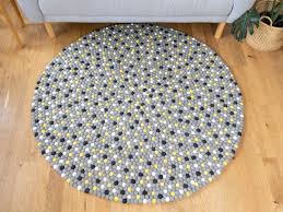yellow mixed felt ball rug
