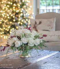 white rose and pine winter centerpiece