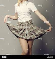 young lady lifting up her short plaid skirt Stock Photo - Alamy
