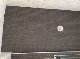dark tile grout in shower not drying