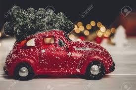 Christmas Present Red Car Toy With Christmas Tree On Top On