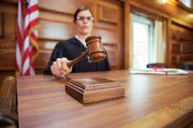 judge banging gavel in court stock