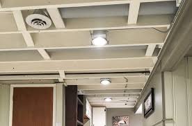 I have a basement ceiling that's around 6'6 high and currently the lights are standard bulb outlets that are attached to the beams so they sit down at eye level in the room. 1000 Diy Basement Renovation First Thyme Mom