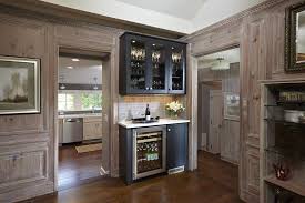 A contemporary dry bar based on english chests on stands. How To Use Cabinetry To Carry Your Style Throughout The Home