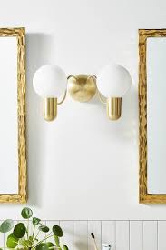 lucia milk glass globes brass double sconce